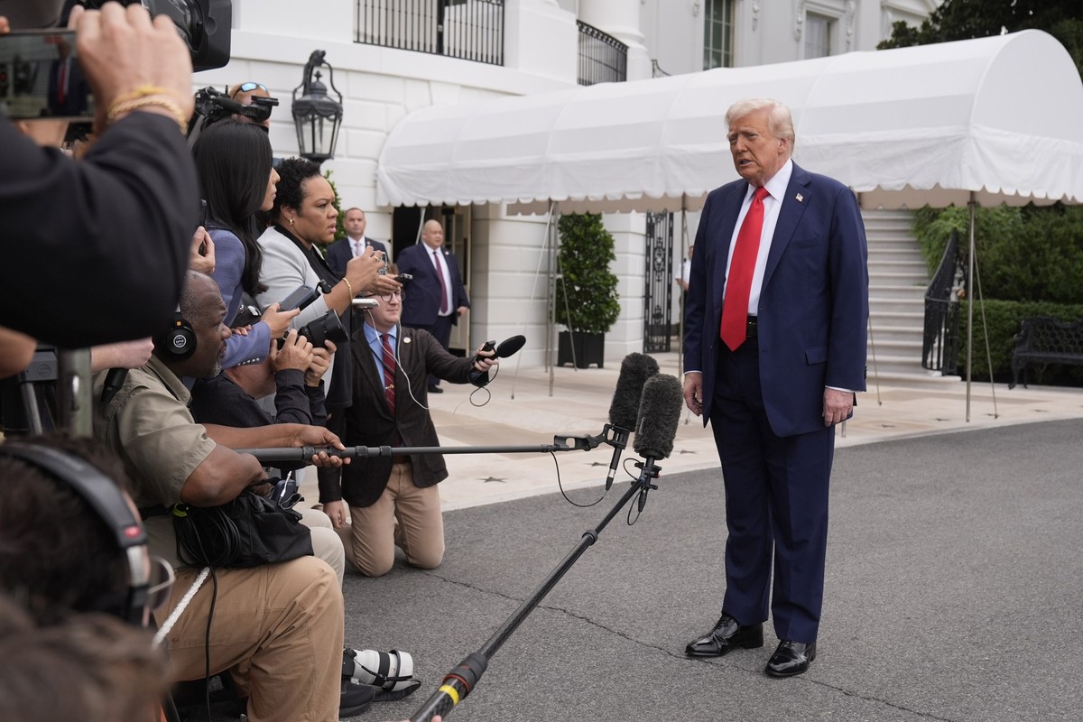President Donald Trump speaking to members of the media on the South Lawn of the White House before he boarding Marine One en route to Joint Base Andrews, Md., Sunday, Sept. 21, 2025, in Washington. ( ...