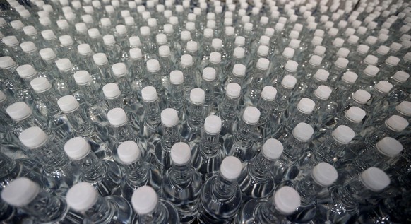 Plastic bottles of mineral water are seen on the bottling line at the Abatilles factory in Arcachon, France, October 10, 2018. REUTERS/Regis Duvignau