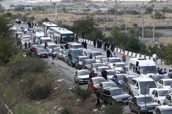 REPUBLIC OF NORTH OSSETIA-ALANIA, RUSSIA - SEPTEMBER 28, 2022: Cars wait in line on the road for the Verkhny Lars checkpoint on the Russian-Georgian border. According to the Georgian Interior Ministry ...