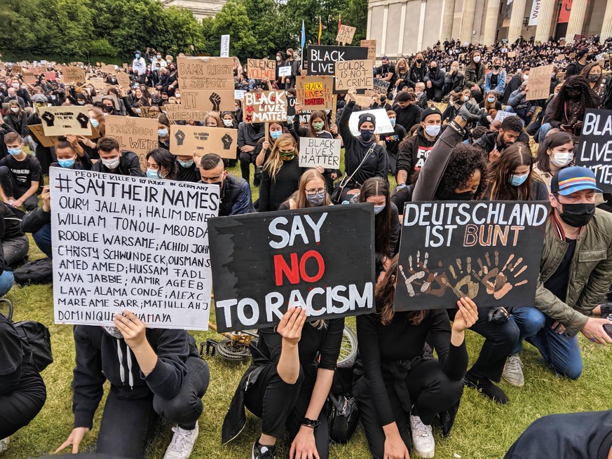 June 6, 2020, Munich, Bavaria, Germany: Demonstrators in Munich, Germany against police brutality and killings kneel in support of Black Lives Matter and the plight of people of color...Showing solida ...