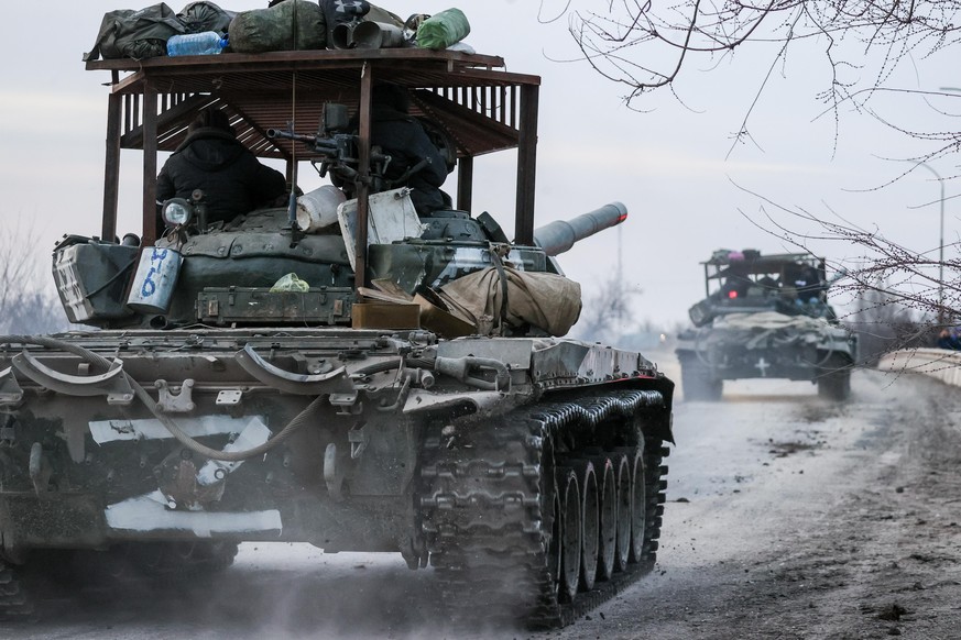 CRIMEA, RUSSIA - FEBRUARY 24, 2022: Tanks move across the town of Armyansk, northern Crimea. Early on February 24, President Putin announced a special military operation to be conducted by the Russian ...