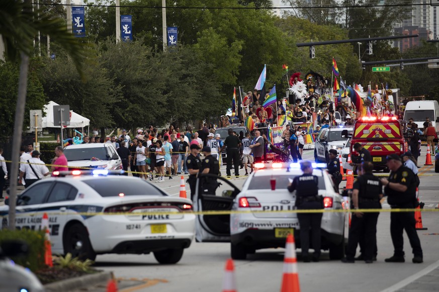 Police and firefighters respond after a truck drove into a crowd of people injuring them during The Stonewall Pride Parade and Street Festival in Wilton Manors, Fla., on Saturday, June 19, 2021. WPLG- ...