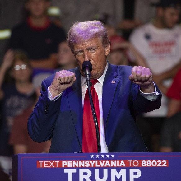 Republican presidential nominee former President Donald Trump makes a boxing gesture as he talks women&#039;s Olympic boxing during campaign rally at Ed Fry Arena in Indiana, Pa., Monday, Sept. 23, 20 ...