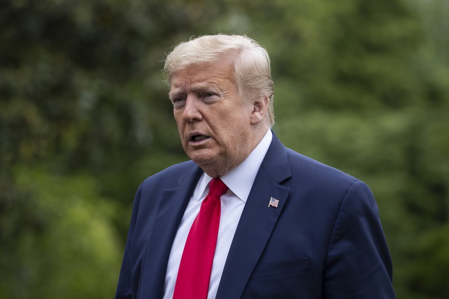 President Donald Trump walks across the South Lawn of White House in Washington, Sunday, May 17, 2020. Trump was returning from nearby Camp David, Md. (AP Photo/Alex Brandon)