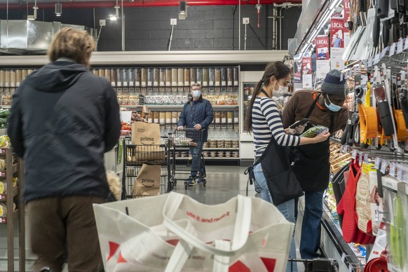 Whole Foods Manhattan West in New York Workers and customers in the produce department in the Whole Foods Manhattan West in the Hudson Yards neighborhood of New York on Saturday, November 28, 2020. PU ...