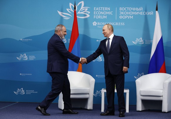VLADIVOSTOK, RUSSIA SEPTEMBER 7, 2022: Armenia s Prime Minister Nikol Pashinyan L and Russia s President Vladimir Putin shake hands during a meeting on the sidelines of the 2022 Eastern Economic Forum ...