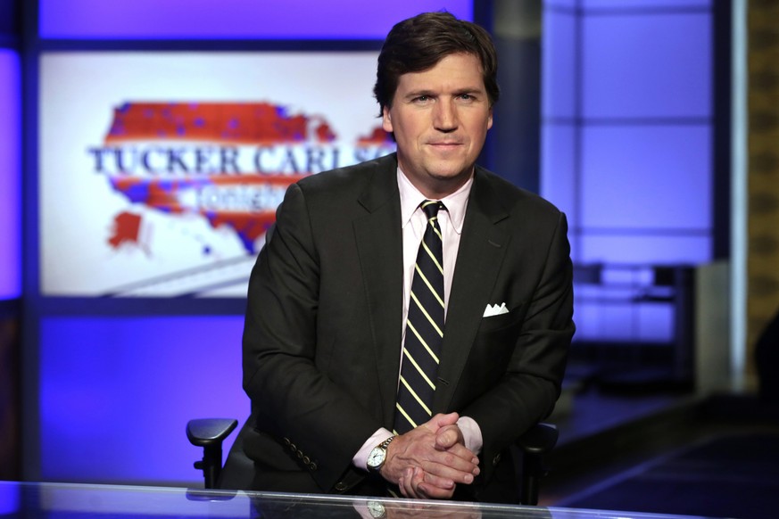 FILE - In this March 2, 2017 file photo, Tucker Carlson, host of &quot;Tucker Carlson Tonight,&quot; poses for photos in a Fox News Channel studio, in New York. Carlson has advocated restraint in deal ...