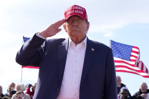 FILE - Republican presidential candidate former President Donald Trump salutes at a campaign rally, March 16, 2024, in Vandalia, Ohio. According to a study released Thursday, April 11, voters in 19 co ...