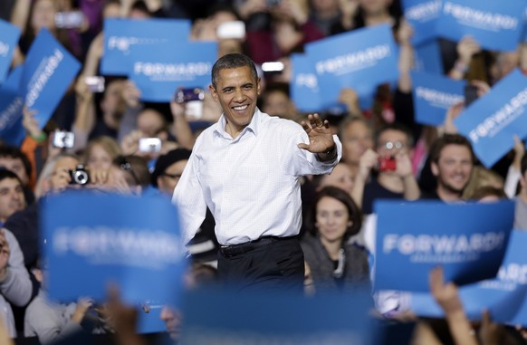FILE - President Barack Obama waves as he is introduced at a campaign event Saturday, Nov. 3, 2012, in Milwaukee. Obama, a Democrat, had a 48% approval rating when he announced his reelection campaign ...