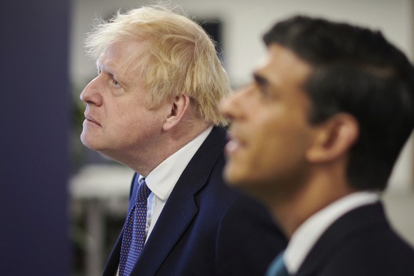 FILE - Britain's Prime Minister Boris Johnson, left, and Chancellor of the Exchequer Rishi Sunak visit the headquarters of Octopus Energy in London, Monday Oct. 5, 2020. Sunak ran for Britain’s top jo ...