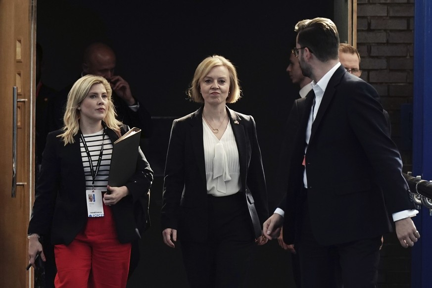 Britain's Prime Minister Liz Truss, centre, arrives for the Conservative Party annual conference at the International Convention Centre in Birmingham, England, Monday, Oct. 3, 2022. (Aaron Chown/PA vi ...