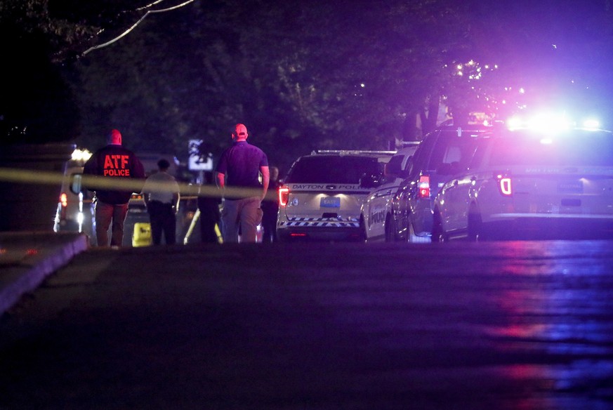 Authorities work at the scene of a mass shooting, Sunday, Aug. 4, 2019, in Dayton, Ohio. Several people in Ohio have been killed in the second mass shooting in the U.S. in less than 24 hours, and the  ...