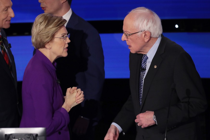DES MOINES, IOWA - JANUARY 14: Sen. Elizabeth Warren (D-MA) and Sen. Bernie Sanders (I-VT) speak after the Democratic presidential primary debate at Drake University on January 14, 2020 in Des Moines, ...