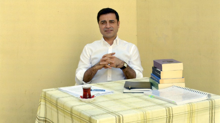 In this handout photo provided by the pro-Kurdish Peoples&#039; Democratic Party (HDP), former co-leader of the party Selahattin Demirtas sits in prison in Turkey, Friday, May 4, 2018. The HDP announc ...