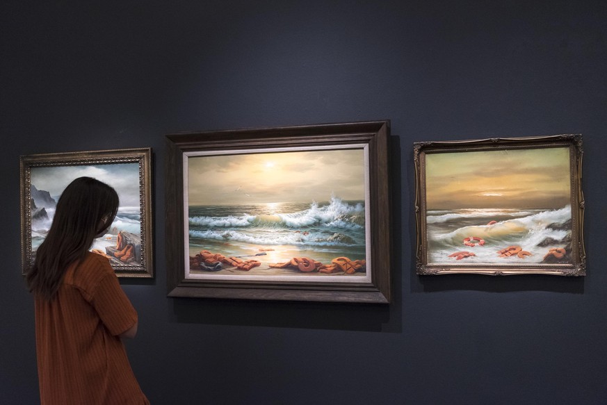 July 23, 2020, London, UK: LONDON, UK. A staff member views &#039;&#039;Mediterranean Sea View 2017 (2017) by Banksy, estimate: Â£800,000-1.2 million. Preview of works on display at Sothebyâs London ...