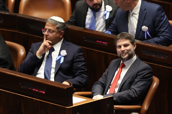 FILE - Israeli right wing Knesset member Itamar Ben Gvir, left, and Bezalel Smotrich look on during the swearing-in ceremony for Israeli lawmakers at the Knesset, Israel&#039;s parliament, in Jerusale ...