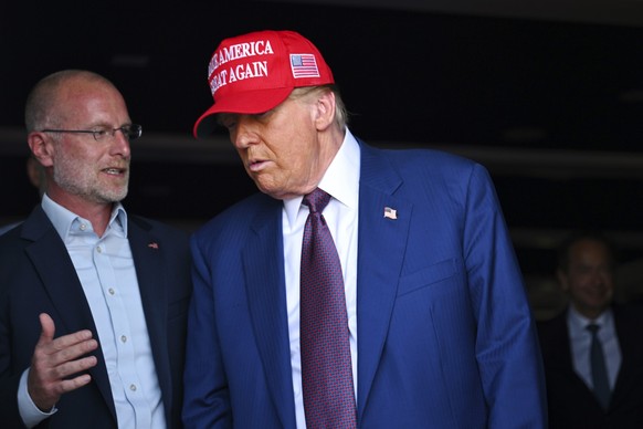 President-elect Donald Trump speaks with talks with Brendan Carr before the launch of the sixth test flight of the SpaceX Starship rocket Tuesday, Nov. 19, 2024 in Boca Chica, Texas. (Brandon Bell/Poo ...