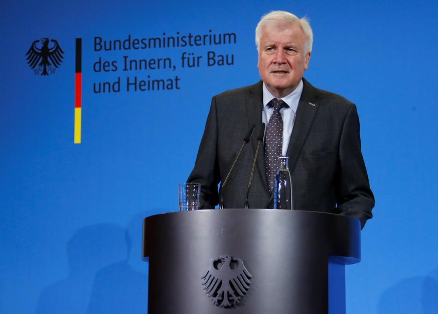 German Interior Minister Horst Seehofer addresses the media at the chancellery in Berlin, Germany, September 23, 2018. REUTERS/Fabrizio Bensch