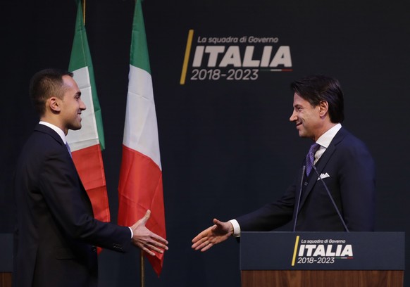 In this photo taken on Thursday, March 1, 2018, Giuseppe Conte, right, shakes hands with leader of the Five-Star Movement, Luigi Di Maio, during a meeting in Rome. Italian media describe Conte as most ...