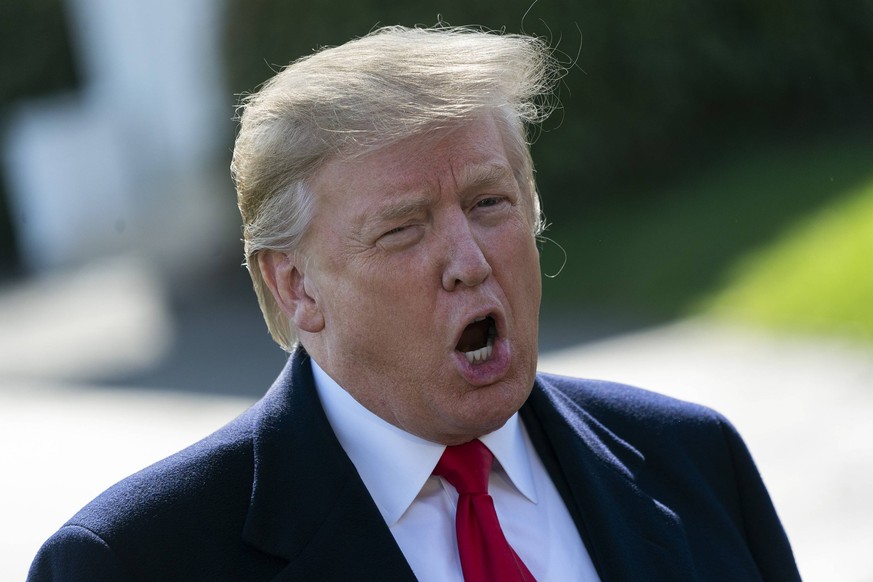 March 28, 2019 - Washington, District of Columbia, U.S. - United States President Donald J. Trump speaks to the media as he departs the White House in Washington, DC, to attend a rally in Grand Rapids ...