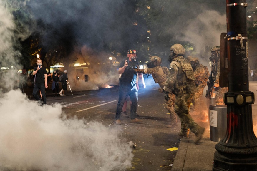July 19, 2020, Portland, Oregon, U.S: July 18, 2020 CBP agents fire tear gas and push a protester at the Federal Courthouse in Portland, Oregon during another night of protests in the city. Portland U ...
