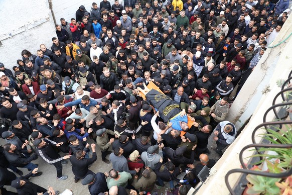 Palestinians attend the funeral of Ali Al-Saadi, 24, who died of an injury sustained by Israeli forces during a raid in Jenin refugee camp last Thursday in the West Bank Palestinians attend the funera ...