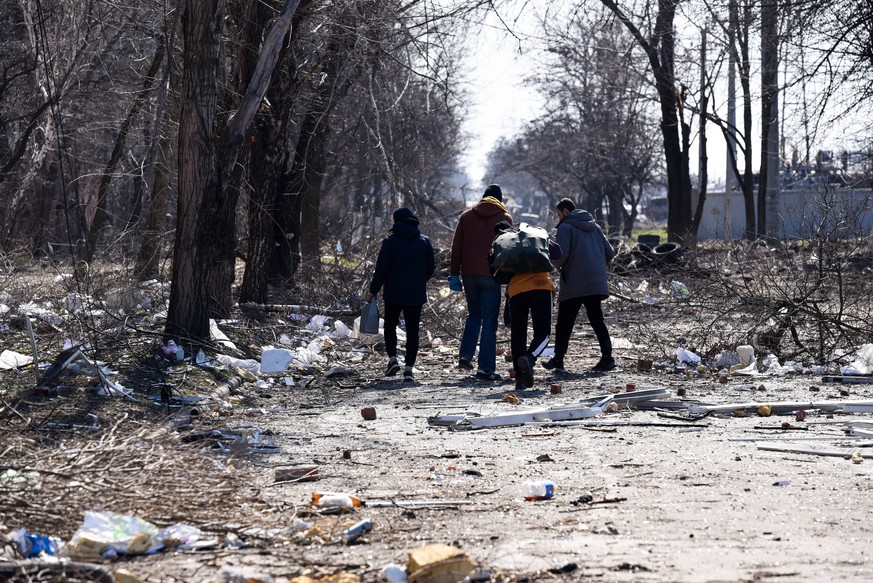 MARIUPOL, UKRAINE - MARCH 19, 2022: People are seen in a street in the city of Mariupol. Tensions started heating up in Donbass on February 17, with the Donetsk and Lugansk People s Republics reportin ...