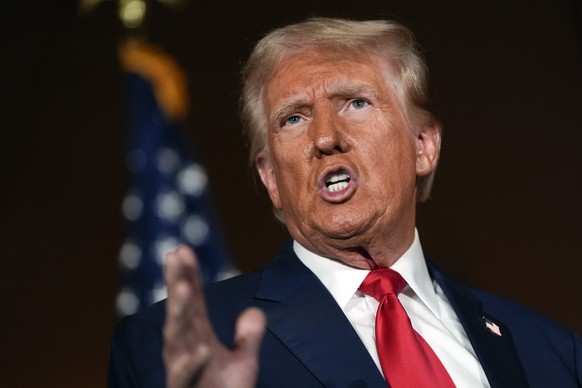 Republican presidential nominee former President Donald Trump talks with reporters at a campaign event at ll Toro E La Capra, Friday, Aug. 23, 2024, in Las Vegas. (AP Photo/Julia Nikhinson)