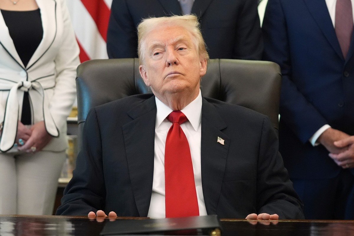 President Donald Trump listens as Health and Human Services Secretary Robert F. Kennedy Jr. speaks during an event about drug prices, Thursday, Nov. 6, 2025, in the Oval Office of the White House in W ...