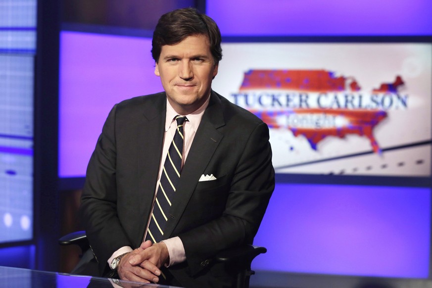FILE - Tucker Carlson, host of &quot;Tucker Carlson Tonight,&quot; poses for photos in a Fox News Channel studio on March 2, 2017, in New York. Dominion Voting Systems&#039; defamation lawsuit against ...