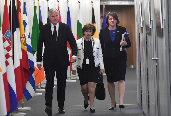 European Union's chief Brexit negotiator Michel Barnier walks with Northern Ireland's Democratic Unionist Party (DUP) leader Arlene Foster and DUP member Diane Dodds prior to a meeting at the EU Commi ...