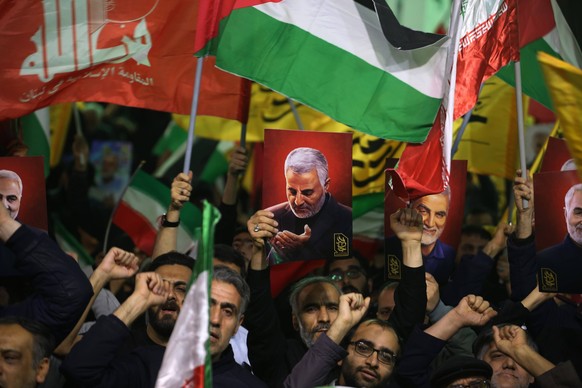 April 1, 2024, Tehran, Iran: An Iranian man holds a poster of former Iranian major general Qasem Soleimani, who was killed in a US drone strike in Baghdad on January 3, 2020, during an anti-Israeli de ...