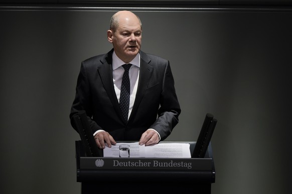 German Chancellor Olaf Scholz addresses the German parliament Bundestag ahead of an EU summit at the Reichstag building in Berlin, Germany, Thursday, Oct. 20, 2022. (AP Photo/Markus Schreiber)