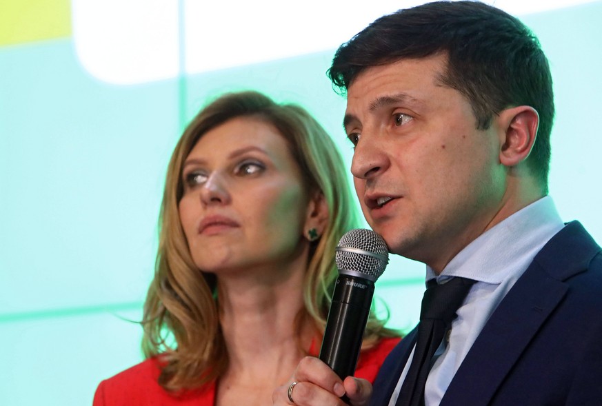 Candidate for presidency of Ukraine, showman Volodymyr Zelenskyi and his wife Olena Zelenska are pictured during the briefing after the announcement of the first exit-poll results according to which h ...