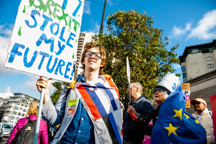 October 19, 2019, London, Greater London, United Kingdom: A man is seen holding an Anti Brexit placard during the demonstration..A few days before the Brexit becomes a reality, one of the biggest publ ...