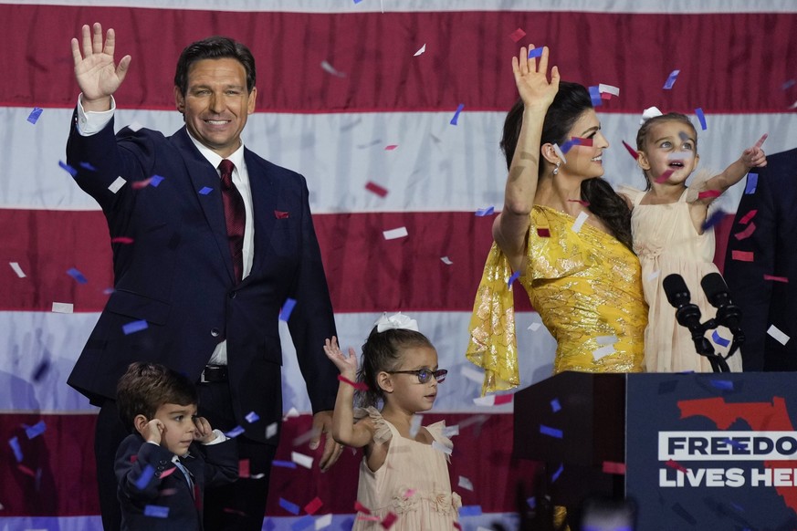 FILE - Incumbent Florida Republican Gov. Ron DeSantis, his wife Casey and their children on stage after speaking to supporters at an election night party after winning his race for reelection in Tampa ...