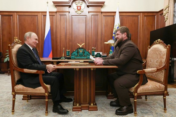 Russian President Vladimir Putin listens to Chechnya&#039;s regional leader Ramzan Kadyrov during their meeting at the Kremlin in Moscow, Russia, Monday, March 13, 2023. (Mikhail Klimentyev, Sputnik,  ...