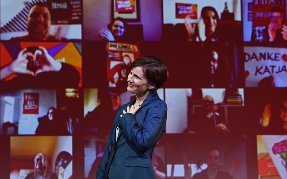 Co-leader of the left wing &quot;Die Linke&quot; (The Left) party Katja Kipping reacts as she receives applause from party members appearing on a video wall, after her speech during the virtual party  ...