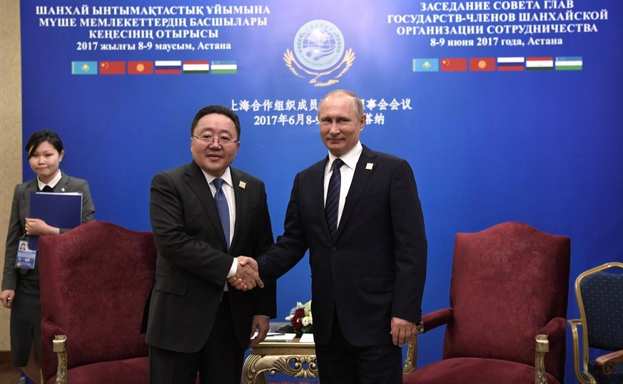 June 9, 2017. - Kazakhstan, Astana. - Russian President Vladimir Putin and President of Mongolia Tsakhiagiin Elbegdorj meet after a meeting of the Council of Heads of the Member States of the Shanghai ...