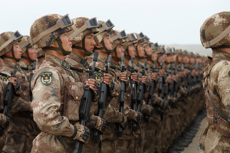 TRANSBAIKAL TERRITORY, RUSSIA - SEPTEMBER 13, 2018: Chinese servicemen march in formation during a parade of military hardware and aviation taking part in the main stage of the Vostok 2018 large-scale ...