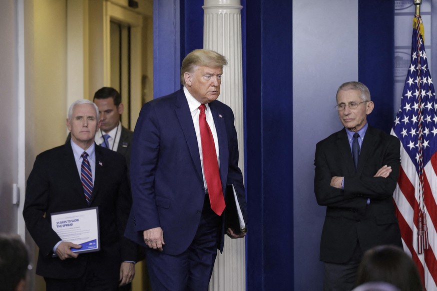 File photo dated March 26, 2020 of United States President Donald J. Trump, followed by US Vice President Mike Pence arrives as Director of the National Institute of Allergy and Infectious Diseases at ...