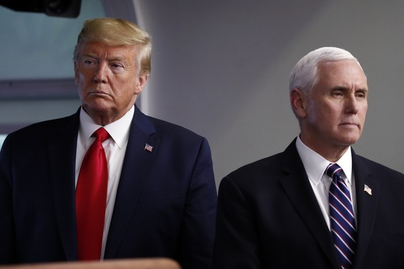 FILE - President Donald Trump and Vice President Mike Pence listen as Secretary of State Mike Pompeo speaks about the coronavirus in the James Brady Press Briefing Room of the White House, April 8, 20 ...