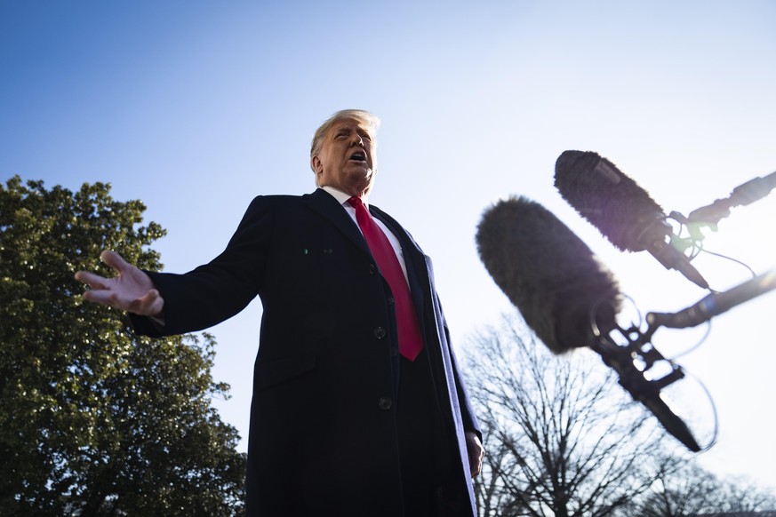 WASHINGTON, DC - JANUARY 12: President Donald J. Trump stops to talk to reporters as he walk to board Marine One and depart from the South Lawn at the White House on Tuesday, Jan 12, 2021 in Washingto ...