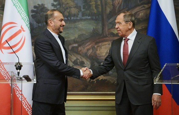 Russia Iran 8400865 29.03.2023 Russian Foreign Minister Sergey Lavrov and Iranian Foreign Minister Hossein Amir-Abdollahian shake hands during a joint news conference following their meeting, in Mosco ...