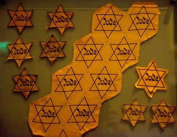 The yellow stars worn by Jews are displayed in an exhibition commemorating the genocide of six million Jews by the Nazi regime during World War II in Yad Vashem, the World Holocaust Remembrance Center ...