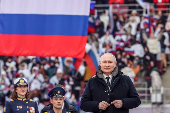 RUSSIA, MOSCOW - FEBRUARY 22, 2023: Russia s President Vladimir Putin R at an open-air concert and rally titled Glory to Defenders of Our Fatherland in Luzhniki, on the eve of Russia s Defender of the ...
