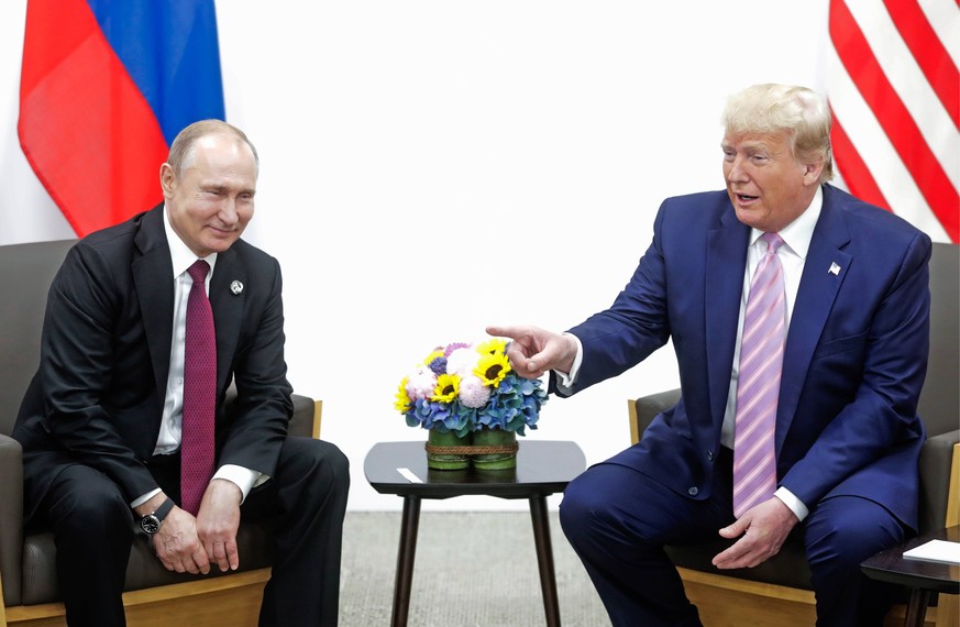 OSAKA, JAPAN - JUNE 28, 2019: Russia s President Vladimir Putin (L) and US President Donald Trump during a meeting on the sidelines of the 2019 G20 Summit at the INTEX Osaka International Exhibition C ...