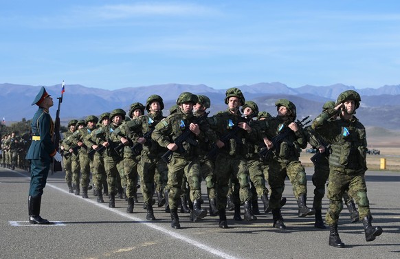 Azerbaijan Russia Peacekeeping Forces 6692988 10.11.2021 Russian peacekeepers march in formation during the solemn ceremony marking the first anniversary of the introduction of the peacekeeping contin ...