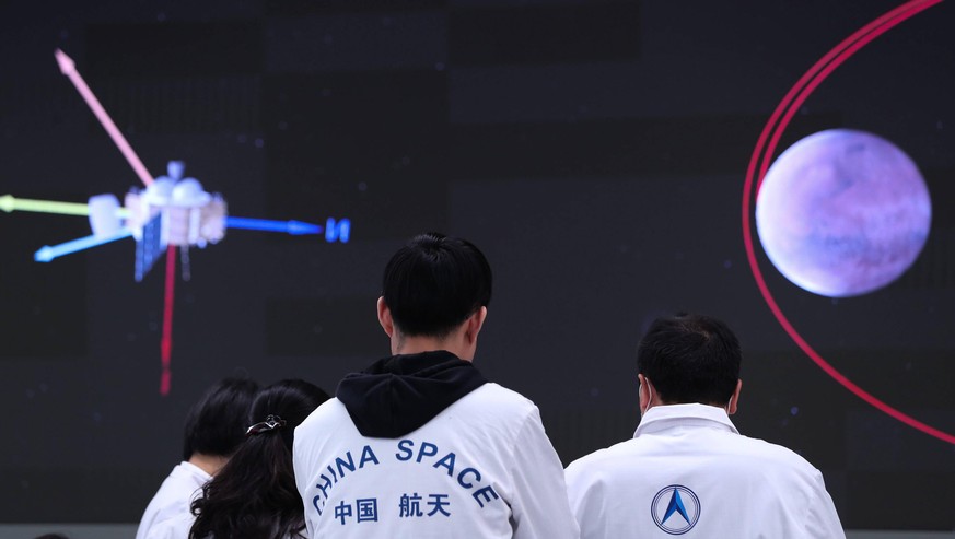 210515 -- BEIJING, May 15, 2021 -- Technical personnel work at the Beijing Aerospace Control Center in Beijing, capital of China, May 15, 2021. The lander carrying China s first Mars rover has touched ...