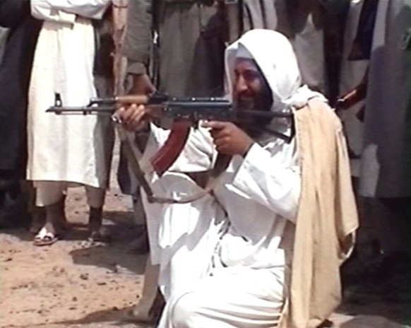 395348 02: Saudi-born terrorist suspect Osama bin Laden is seen aiming a weapon in this undated photo from Al-Jazeera TV. (Photo by Al-Jazeera/Getty Images)